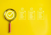 Magnifying glass on yellow background. correct or check E-Document inspection. Business industry quality control