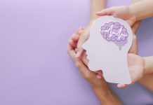 Adult and child hands holding encephalography brain